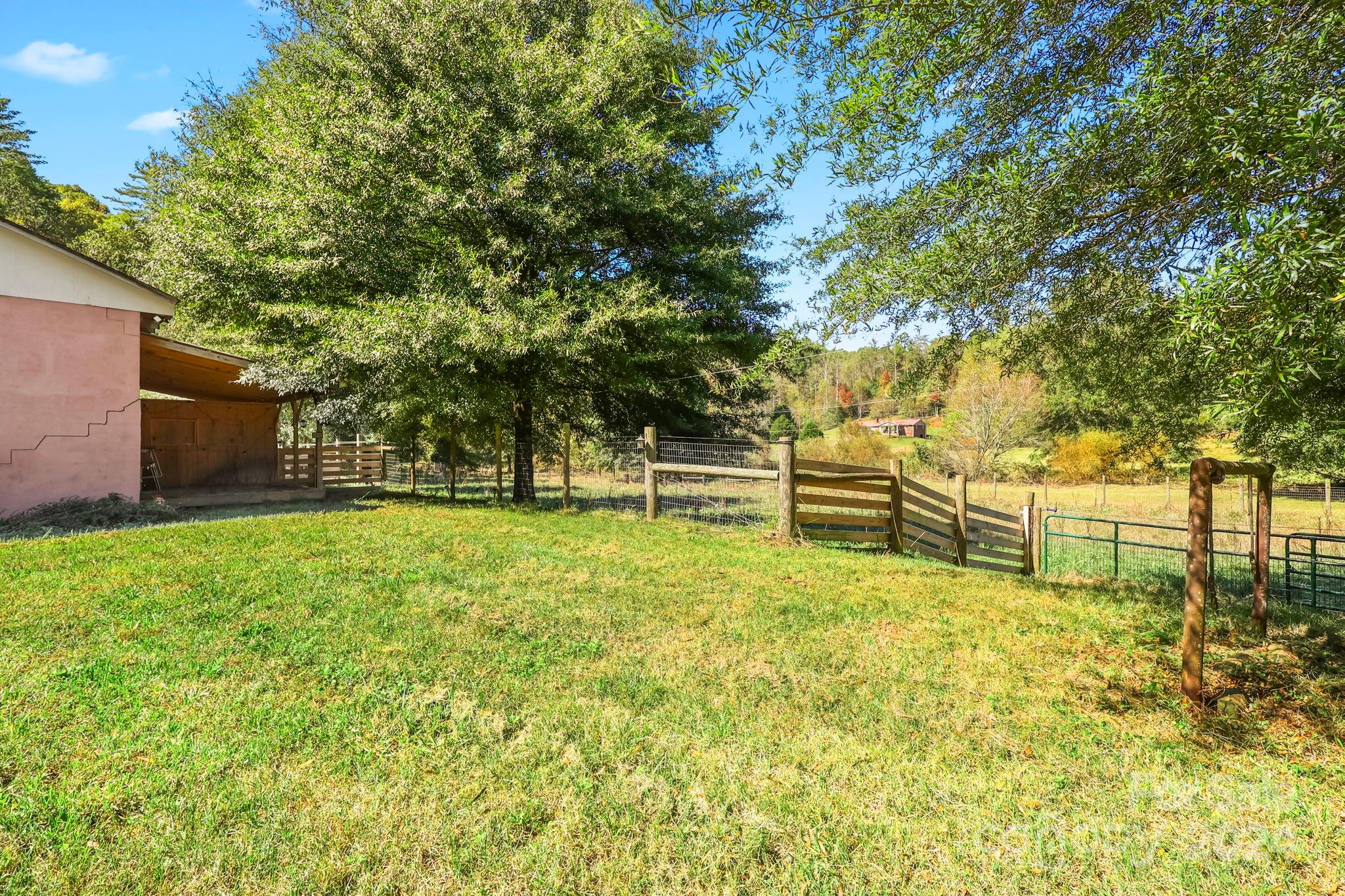 3409 Collettsville Road Lenoir, NC 28645 - Photo 41 of 48 a backyard of a house with lots of green space