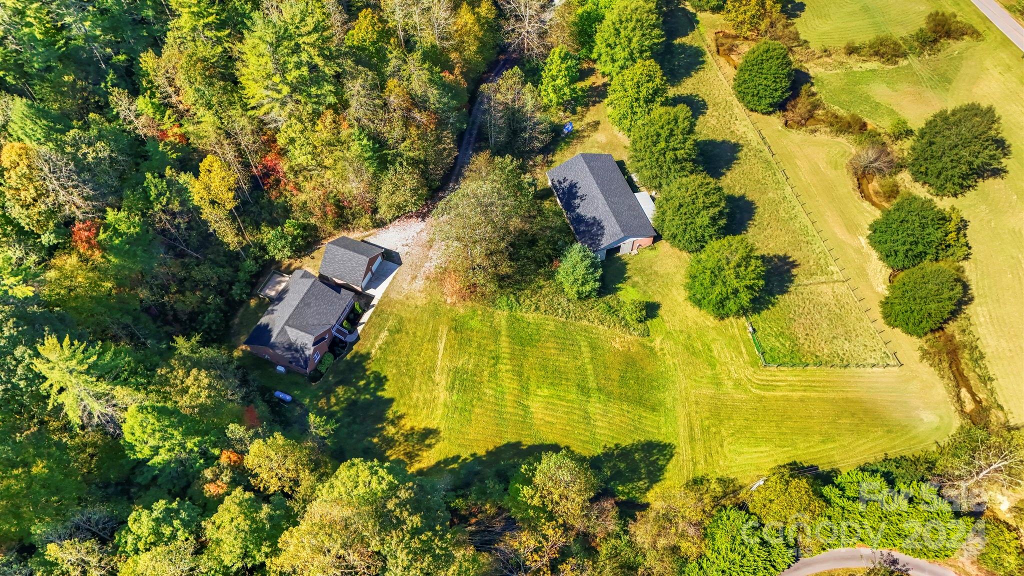 3409 Collettsville Road Lenoir, NC 28645 - Photo 48 of 48 a aerial view of residential houses with swimming pool