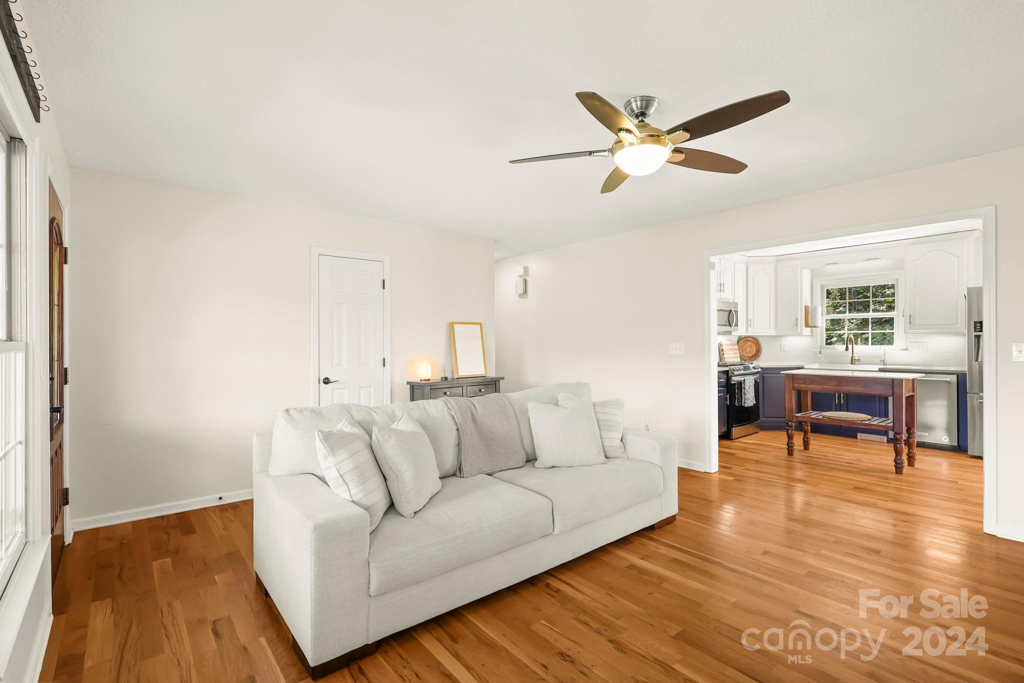 3409 Collettsville Road Lenoir, NC 28645 - Photo 6 of 48 a living room with furniture and a ceiling fan