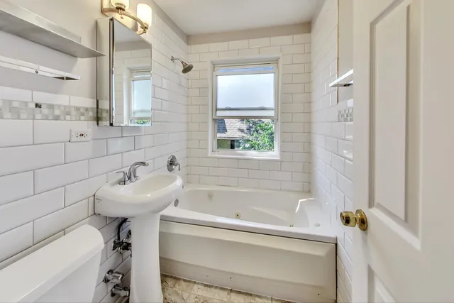 a bathroom with a sink and a bathtub