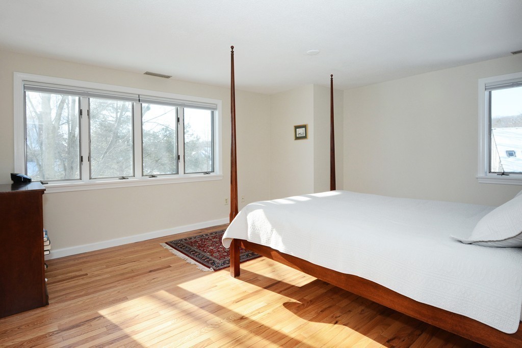 11 Old Nugent Farm Road, Unit 11 Gloucester, MA 01930 - Photo 18 of 30 a bedroom with a bed and a window