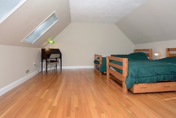 11 Old Nugent Farm Road, Unit 11 Gloucester, MA 01930 - Photo 22 of 30 a room with stairs and a wooden floor