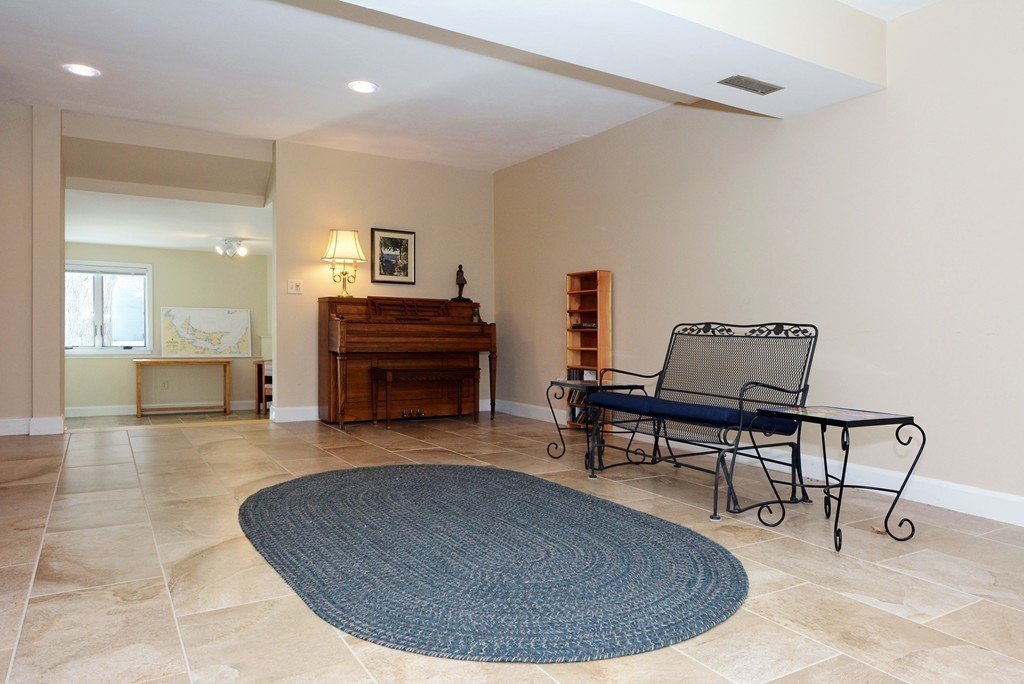 11 Old Nugent Farm Road, Unit 11 Gloucester, MA 01930 - Photo 23 of 30 a living room with furniture and a piano