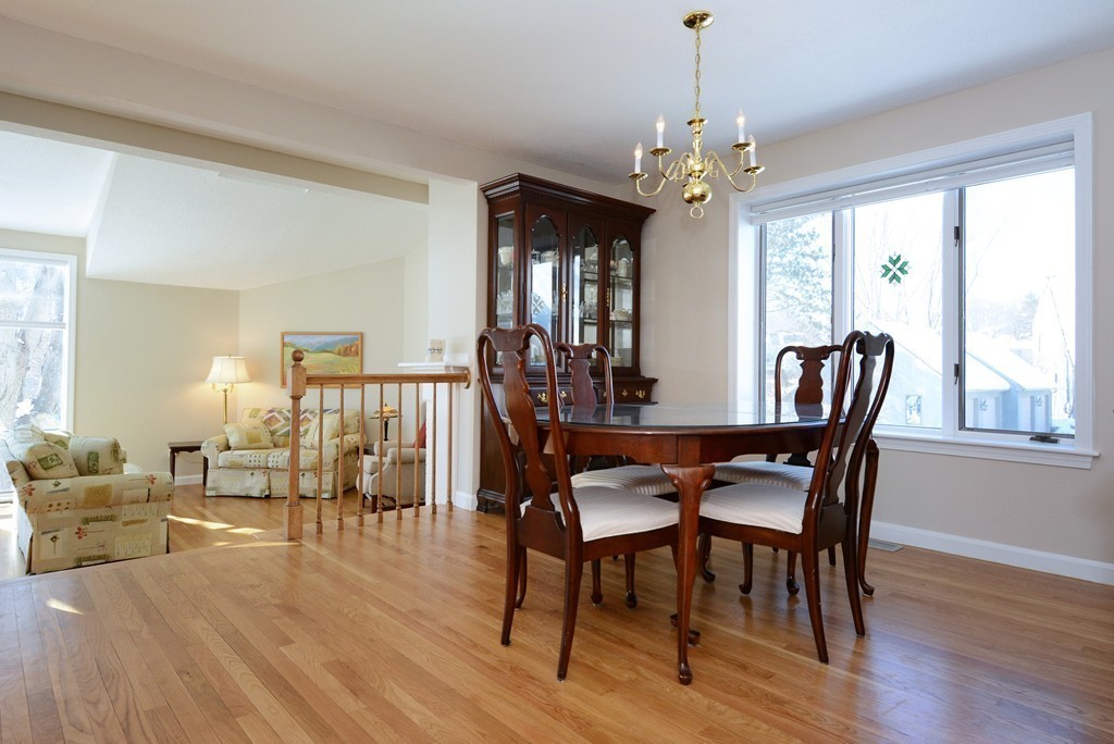 11 Old Nugent Farm Road, Unit 11 Gloucester, MA 01930 - Photo 6 of 30 a view of a dining room with furniture window and wooden floor