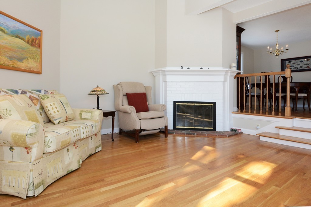 11 Old Nugent Farm Road, Unit 11 Gloucester, MA 01930 - Photo 9 of 30 a living room with furniture and a fireplace