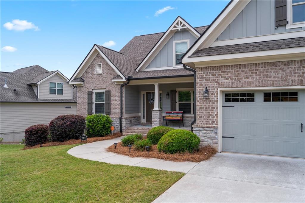 712 Fleeting Way Monroe, GA 30655 - Photo 2 of 29 a front view of a house with garden