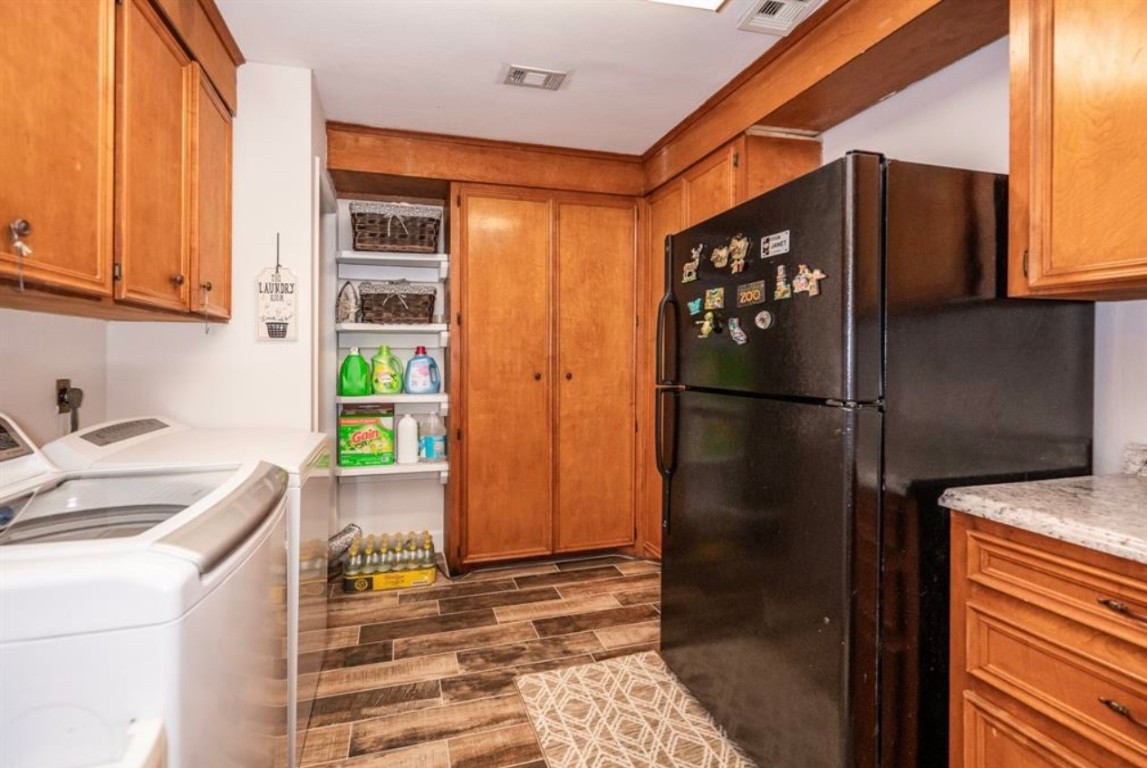 464 River Road Angleton, TX 77515 - Photo 17 of 45 a kitchen with stainless steel appliances granite countertop a refrigerator and a sink