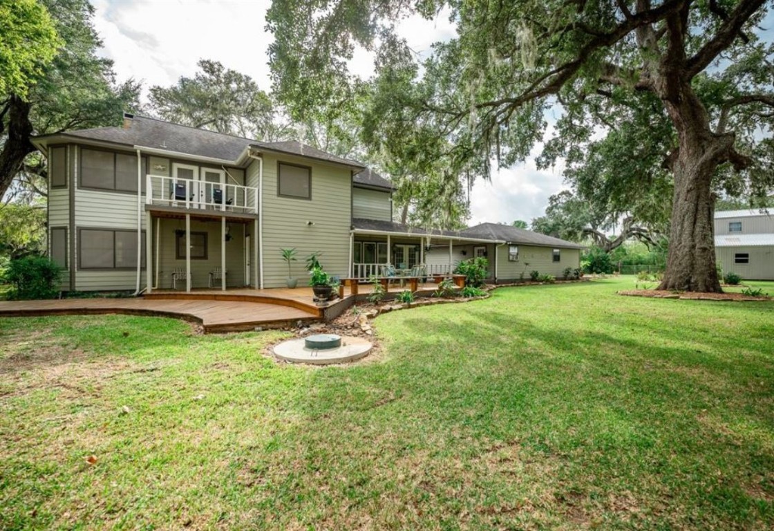 464 River Road Angleton, TX 77515 - Photo 2 of 45 a view of a house with backyard and sitting area