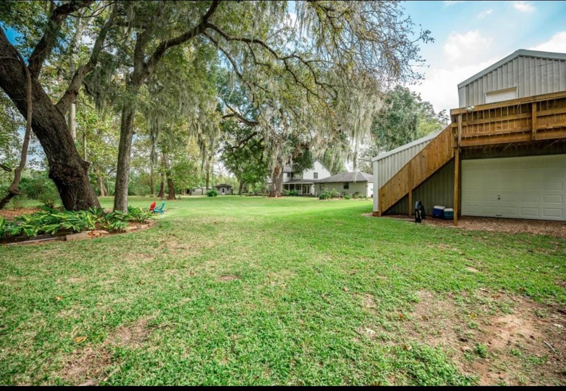 464 River Road Angleton, TX 77515 - Photo 28 of 45 a view of a house with a backyard