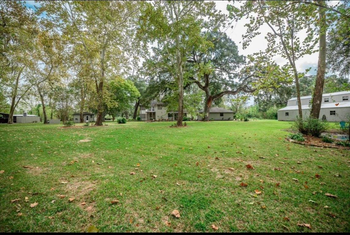 464 River Road Angleton, TX 77515 - Photo 35 of 45 a view of grassy field with benches