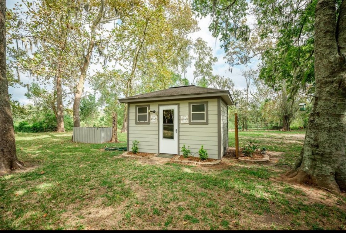 464 River Road Angleton, TX 77515 - Photo 37 of 45 a view of a house with yard and a tree