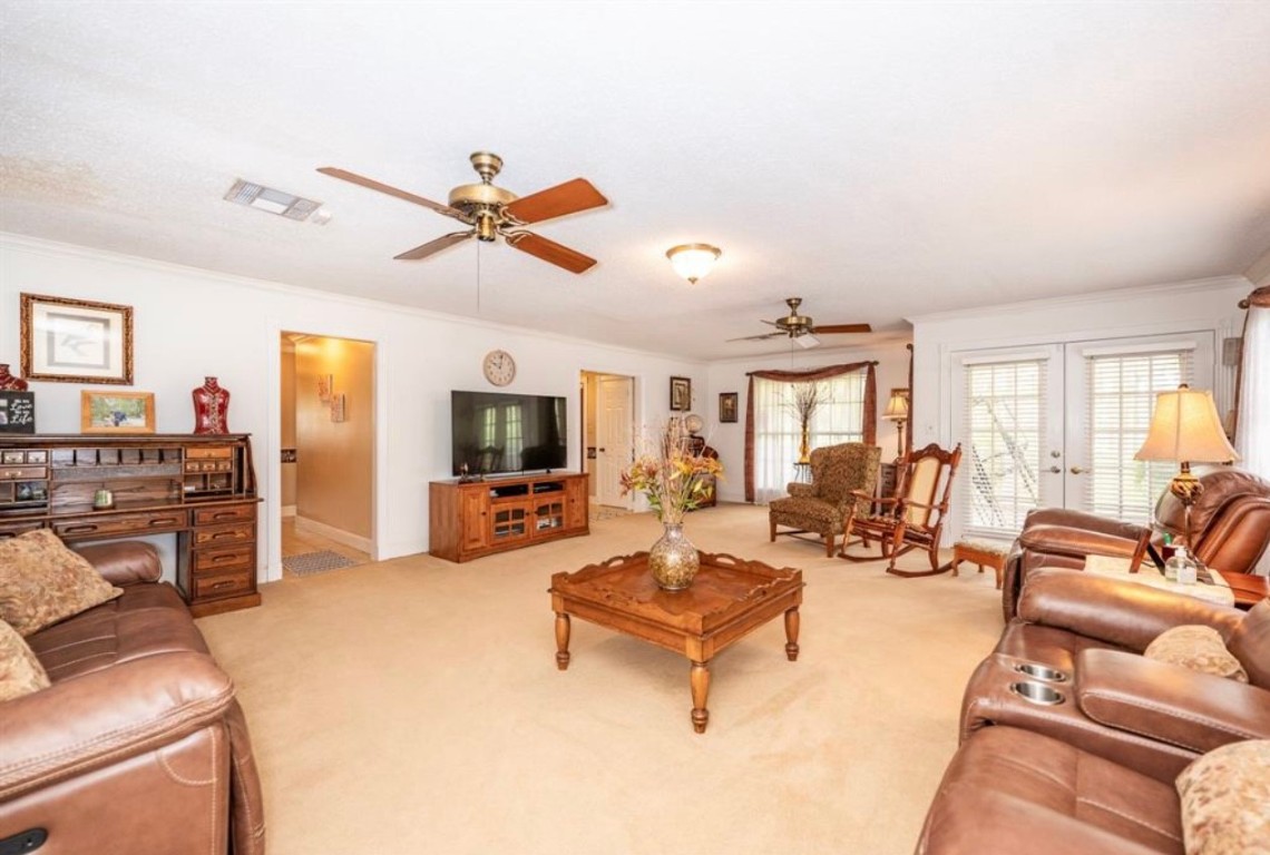 464 River Road Angleton, TX 77515 - Photo 4 of 45 a living room with furniture and a flat screen tv