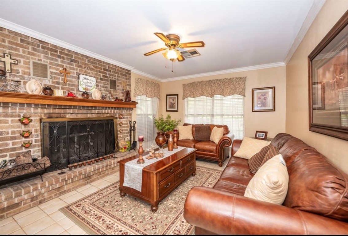 464 River Road Angleton, TX 77515 - Photo 8 of 45 a living room with furniture a window and a fireplace