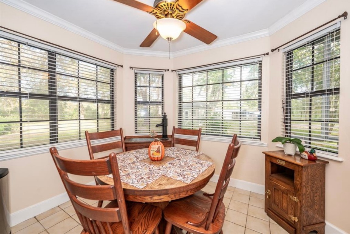 464 River Road Angleton, TX 77515 - Photo 10 of 45 a dining room with furniture a chandelier and wooden floor