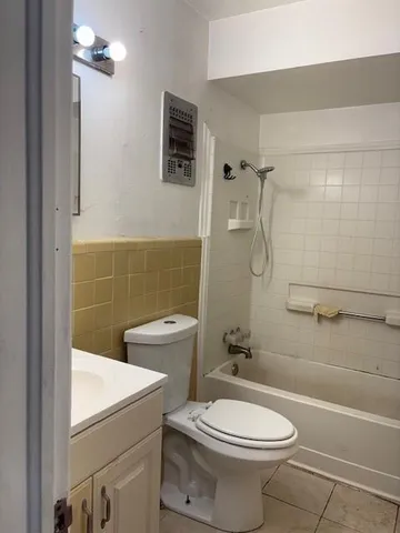 a bathroom with a toilet sink and shower
