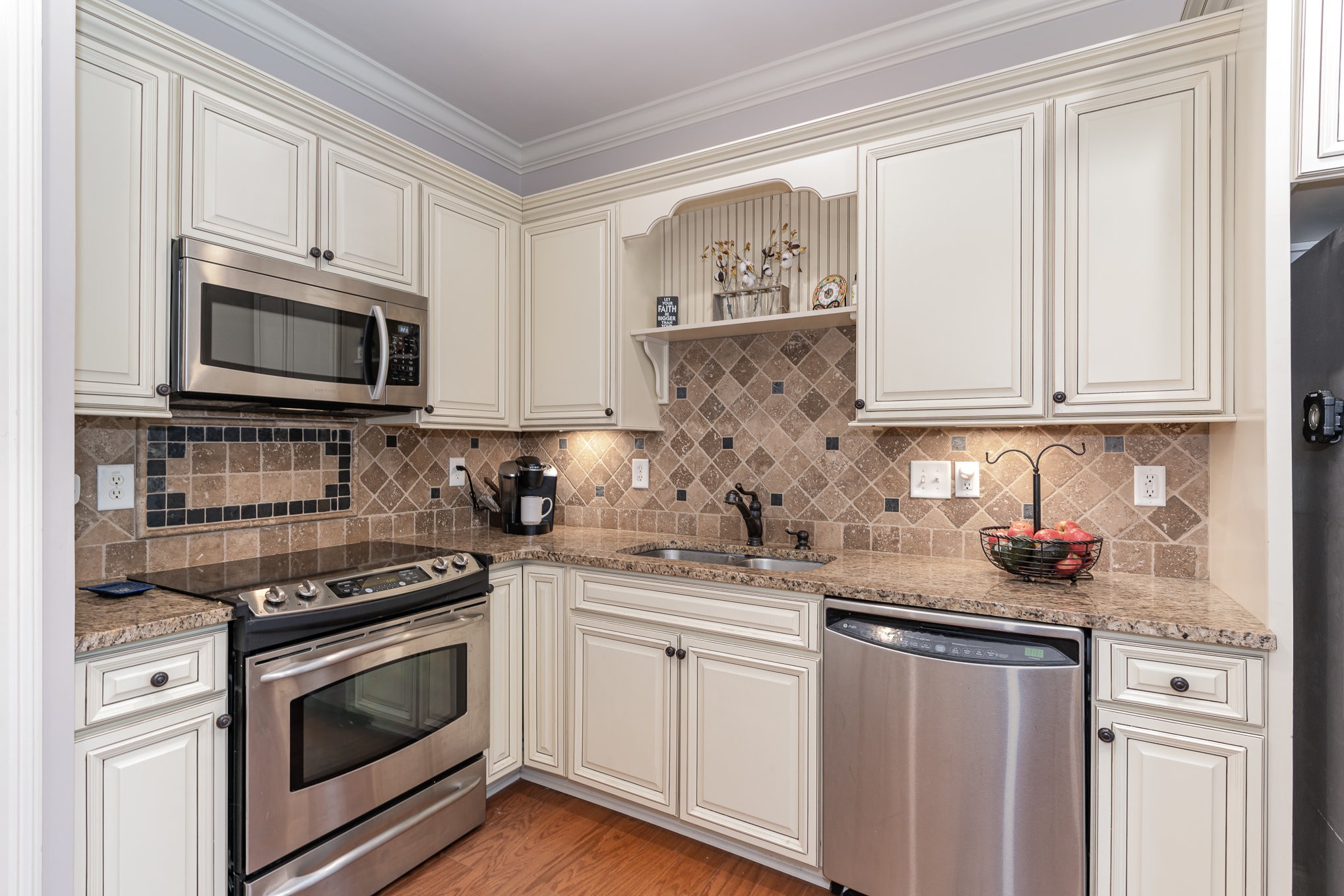 4229 Prestwick Place Spring Hill, TN 37174 - Photo 14 of 29 a kitchen with stainless steel appliances granite countertop a sink stove and microwave