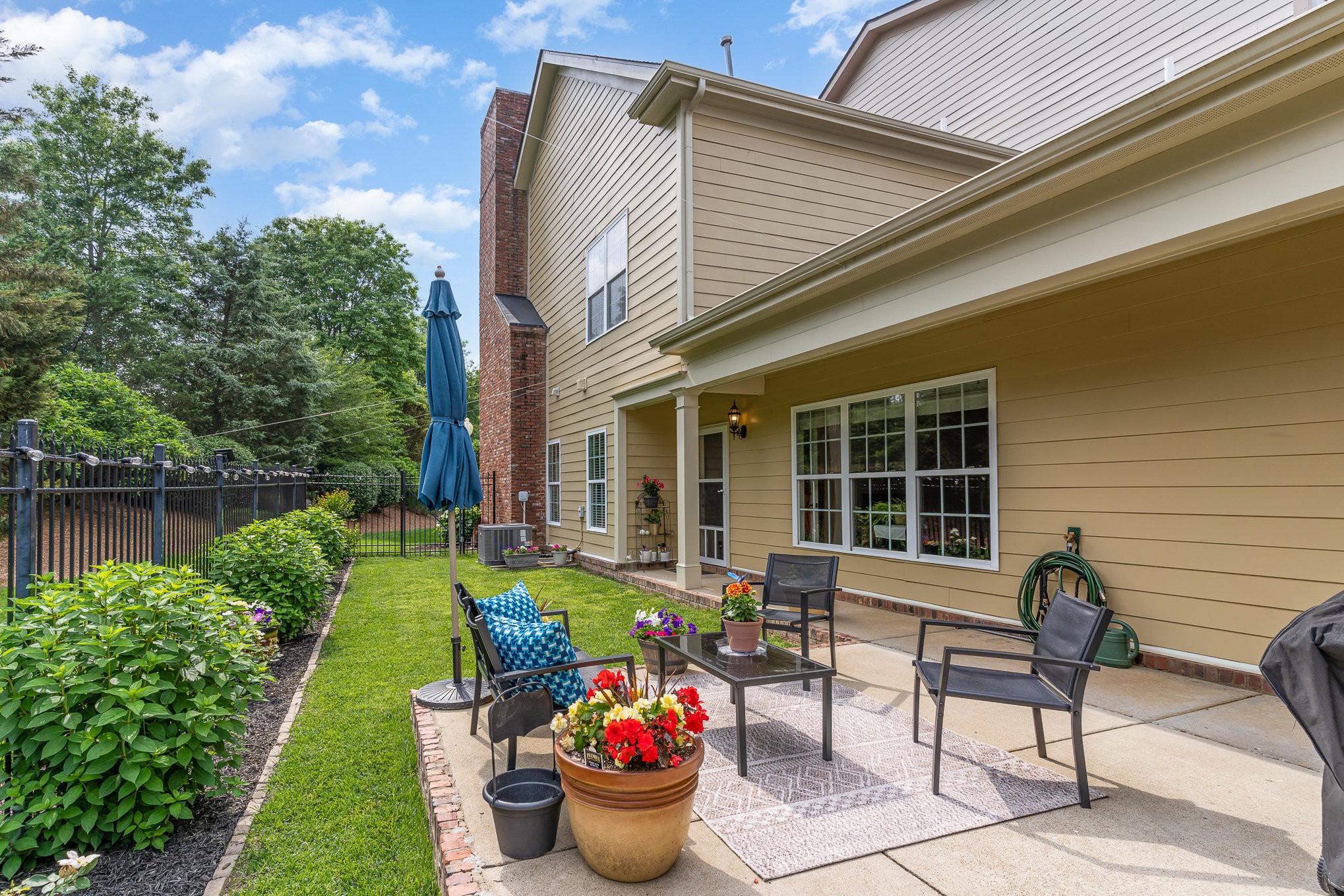 4229 Prestwick Place Spring Hill, TN 37174 - Photo 26 of 29 a front view of a house with garden and chairs