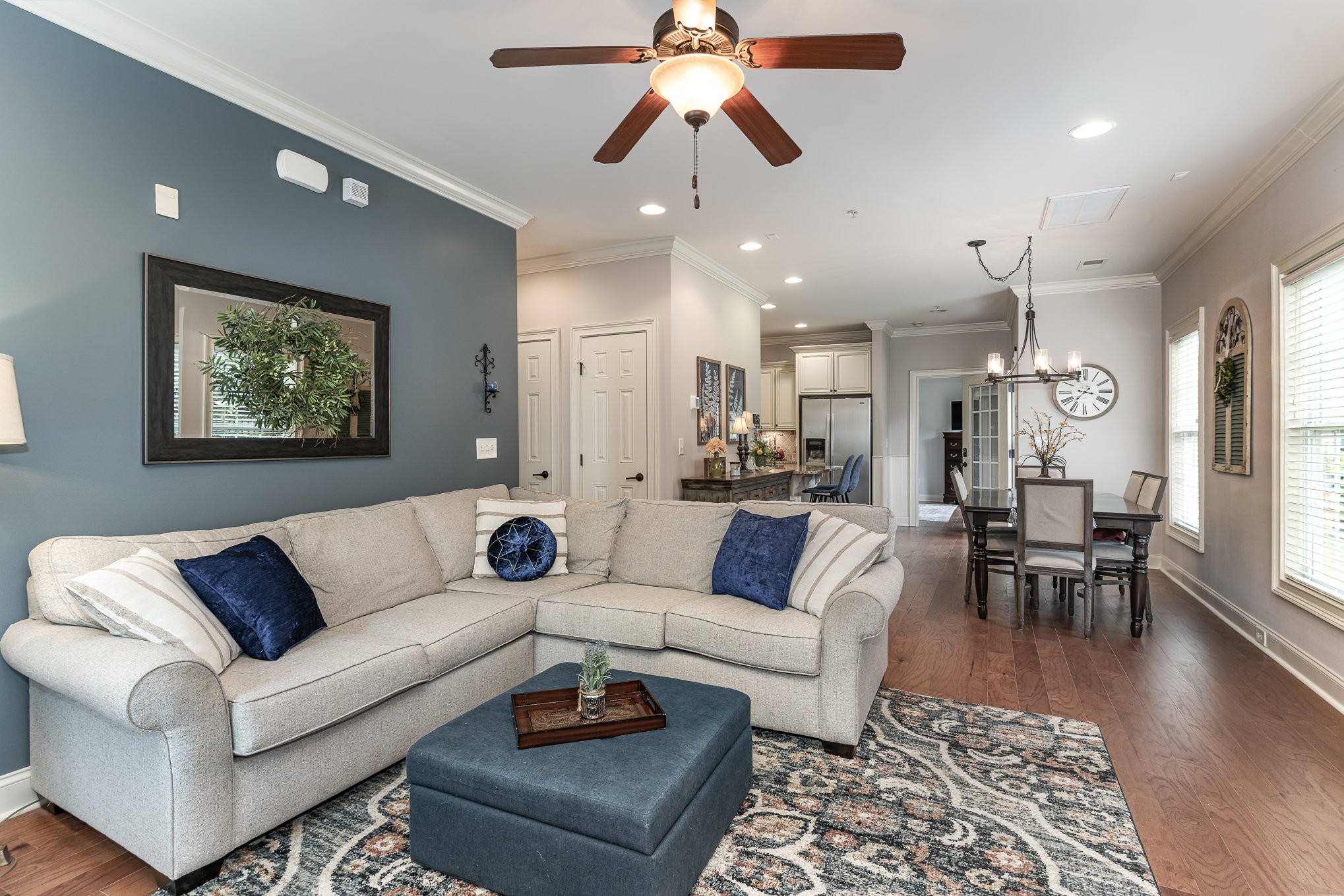 4229 Prestwick Place Spring Hill, TN 37174 - Photo 8 of 29 a living room with furniture and a chandelier