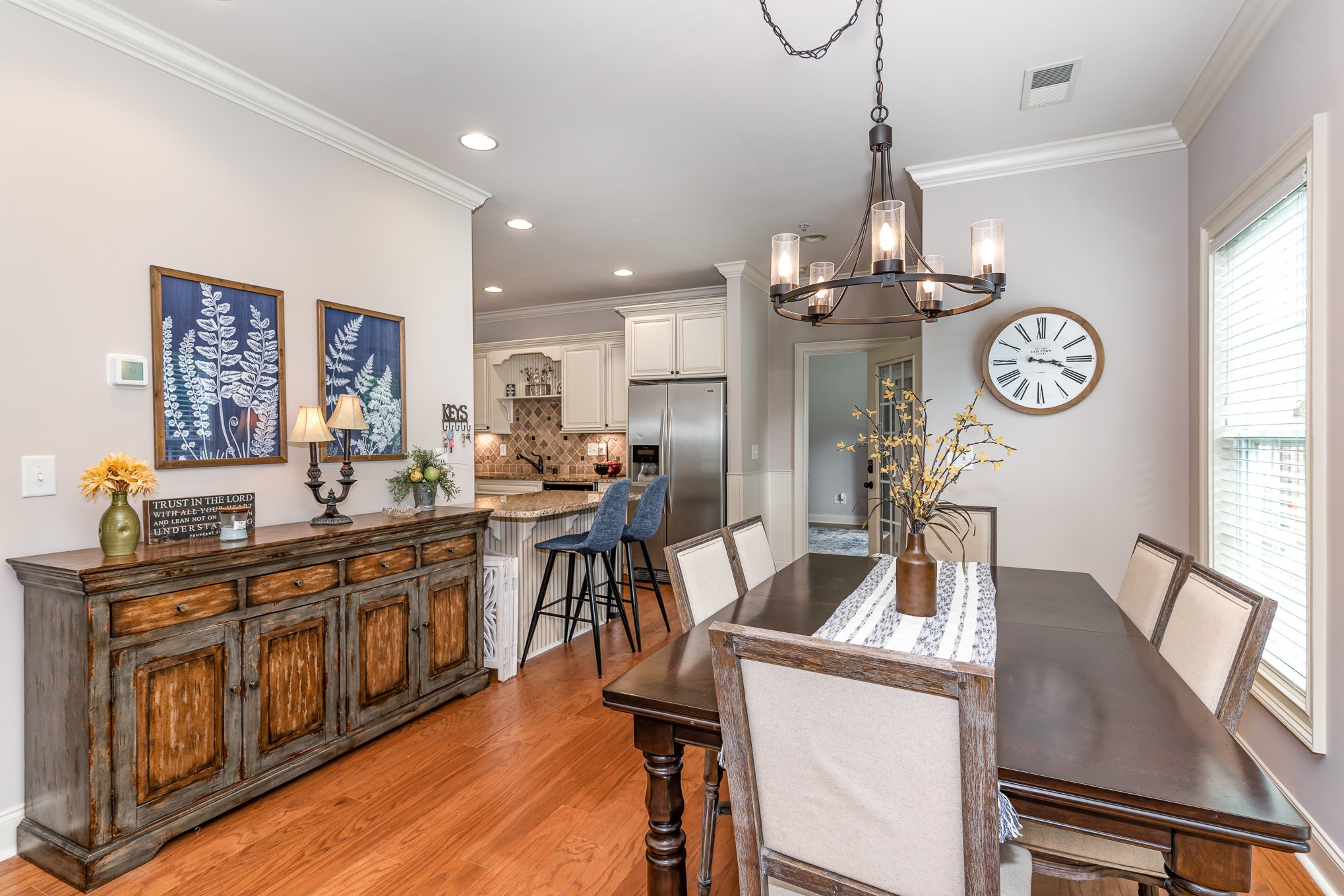 4229 Prestwick Place Spring Hill, TN 37174 - Photo 10 of 29 a view of a dining room with furniture a chandelier and wooden floor