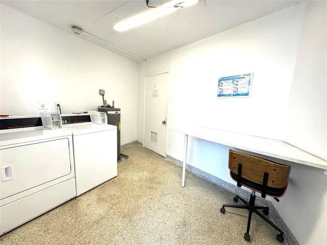 a view of a workspace with furniture