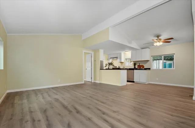 a view of kitchen with wooden floor