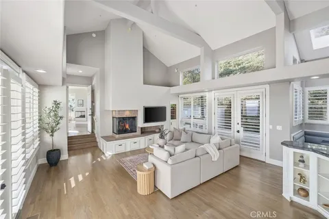 a living room with fireplace furniture and a flat screen tv