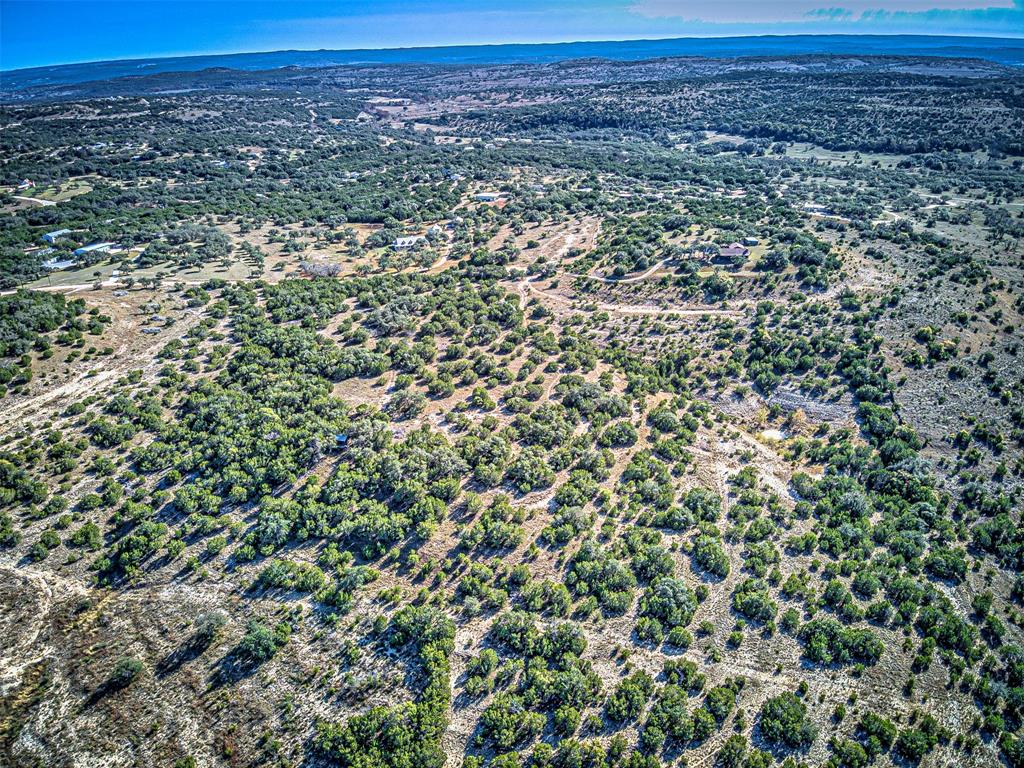 414 Hall Lane Spicewood, TX 78669 - Photo 4 of 16 a view of a field with a mountain in the background