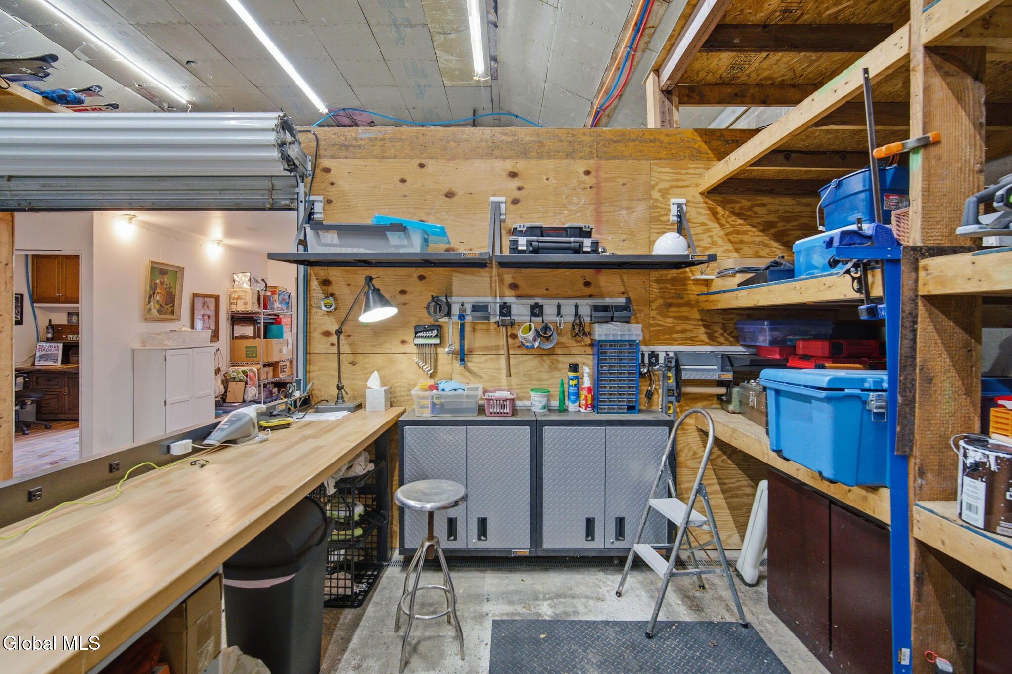 447 Krumkill Road Albany, NY 12203 - Photo 49 of 65 Garage workspace with shelves