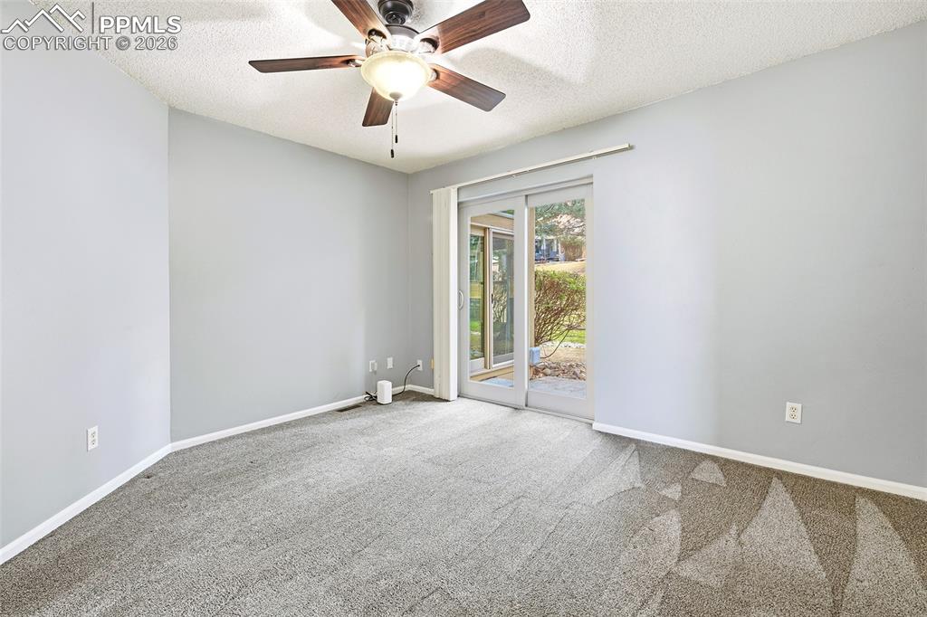 365 Autumn Ridge Circle, Unit A Colorado Springs, CO 80906 - Photo 12 of 30 The main-level primary suite offers private patio access...