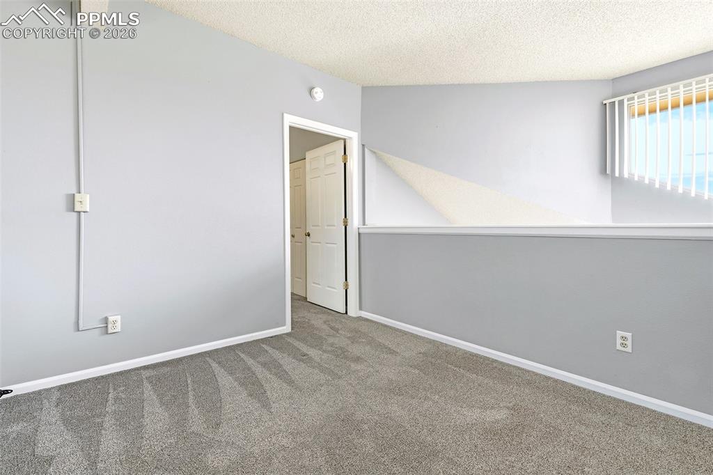 365 Autumn Ridge Circle, Unit A Colorado Springs, CO 80906 - Photo 15 of 30 Upstairs, a versatile loft overlooks the living space and kitchen from above...