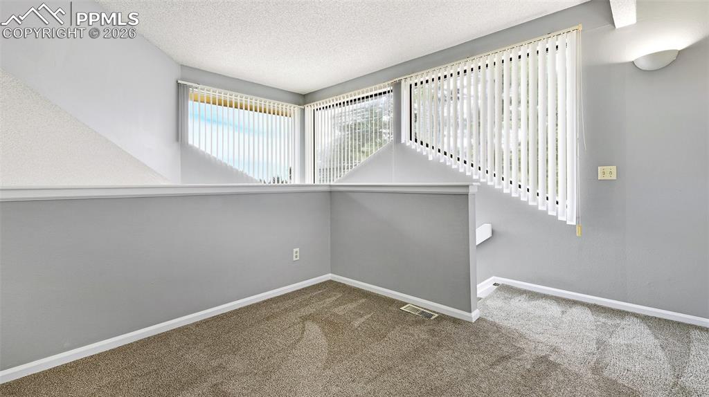 365 Autumn Ridge Circle, Unit A Colorado Springs, CO 80906 - Photo 17 of 30 incredible large trapezoid widows and natural light!