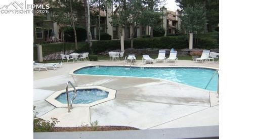 365 Autumn Ridge Circle, Unit A Colorado Springs, CO 80906 - Photo 29 of 30 outdoor pool, spa, & fully equipped gym perfect for year-round fitness, leisure & social gatherings.