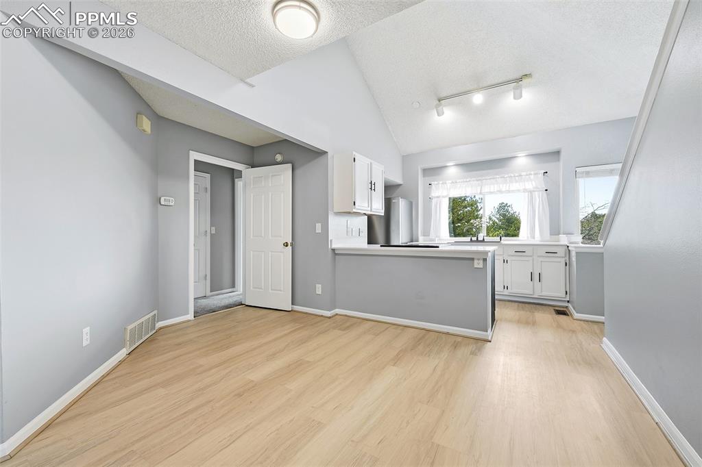 365 Autumn Ridge Circle, Unit A Colorado Springs, CO 80906 - Photo 8 of 30 Spacious dining area open to the kitchen and counter bar.