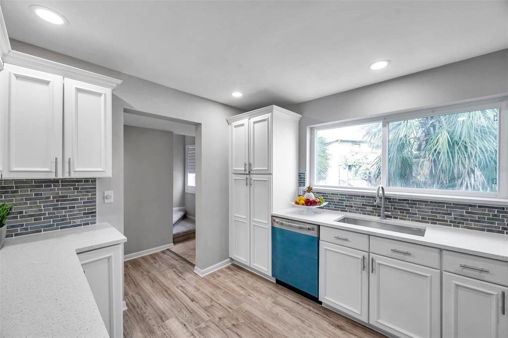 6311 Newtown Circle, Unit 11B1 Tampa, FL 33615 - Photo 18 of 49 a kitchen with stainless steel appliances granite countertop a sink stove and refrigerator