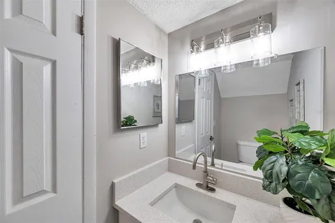 a bathroom with a sink and mirror