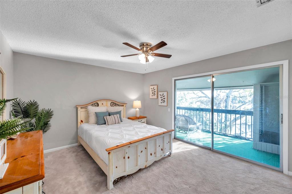 6311 Newtown Circle, Unit 11B1 Tampa, FL 33615 - Photo 23 of 49 a bedroom with a bed and a large window