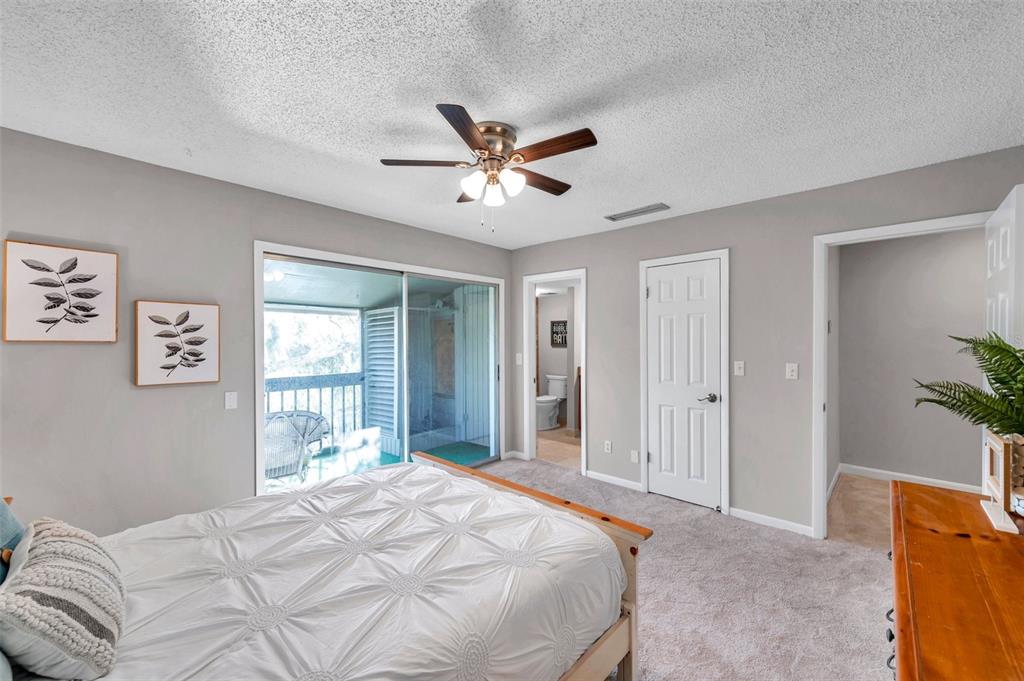 6311 Newtown Circle, Unit 11B1 Tampa, FL 33615 - Photo 26 of 49 a bedroom with a bed and a window