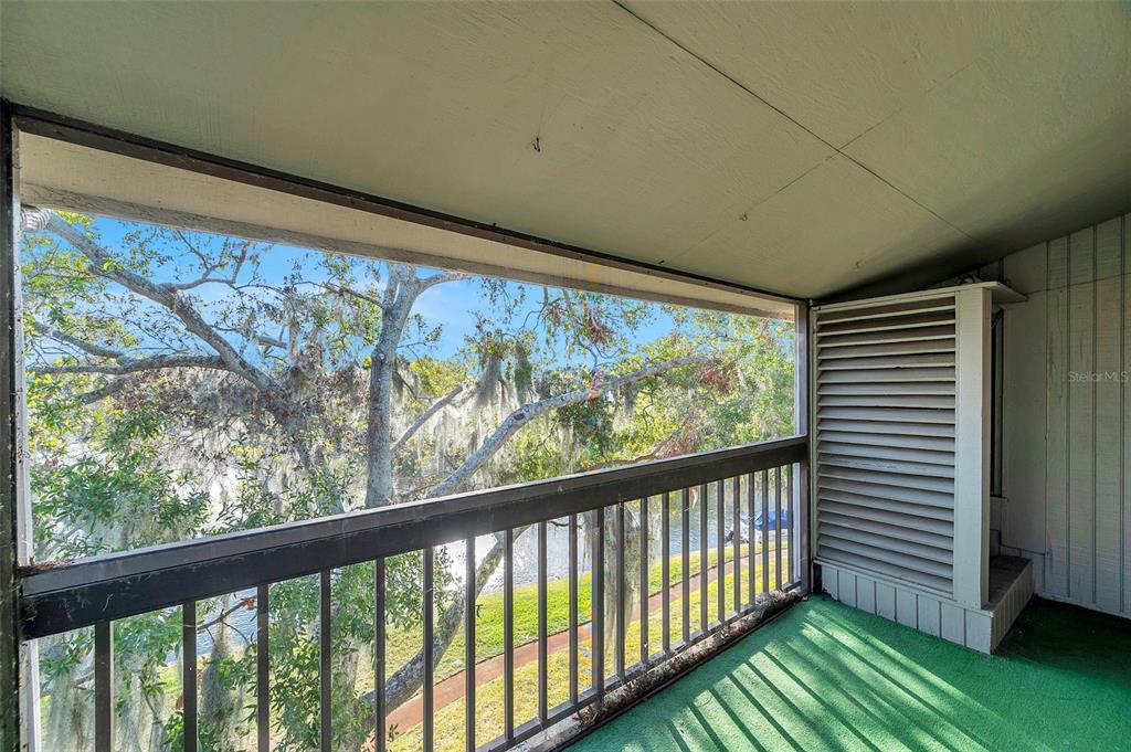 6311 Newtown Circle, Unit 11B1 Tampa, FL 33615 - Photo 30 of 49 a view of a porch with a large window