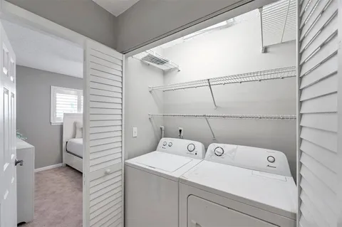 a view of a bathroom with a sink and wooden floor