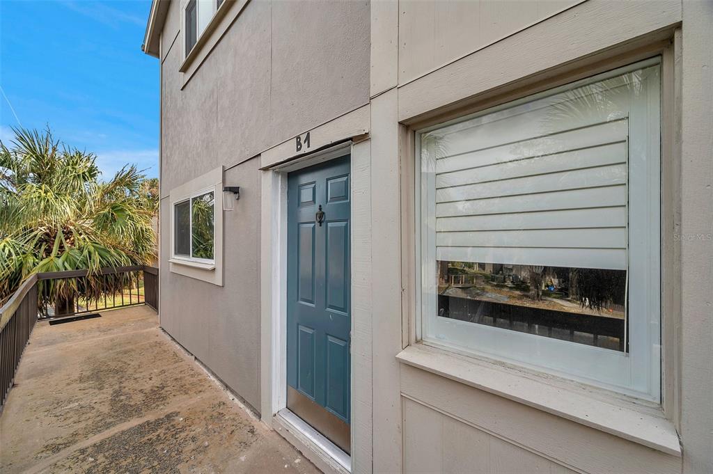 6311 Newtown Circle, Unit 11B1 Tampa, FL 33615 - Photo 7 of 49 a front view of a house with entryway