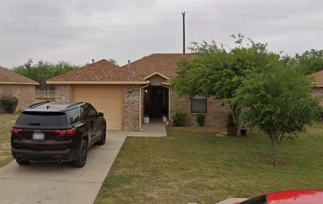 a car parked in front of a house