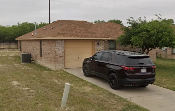 a car parked in front of a house