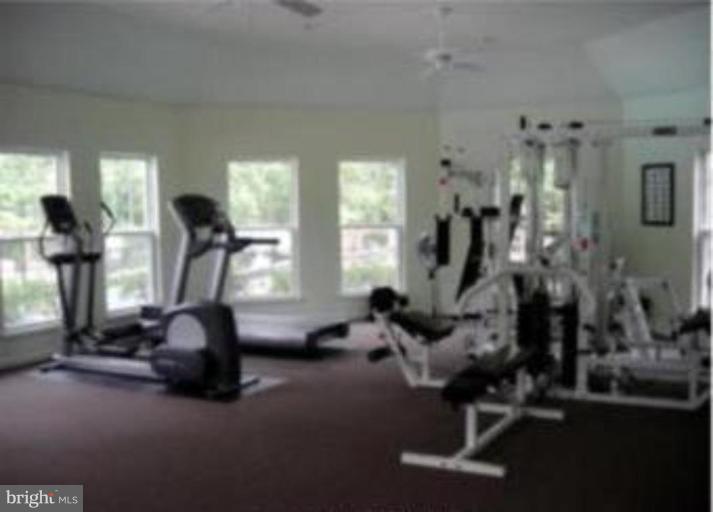 721 Runabout Loop, Unit 721 Solomons, MD 20688 - Photo 13 of 23 a view of a room with gym equipment