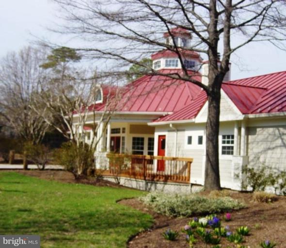 721 Runabout Loop, Unit 721 Solomons, MD 20688 - Photo 19 of 23 a view of a house with a yard