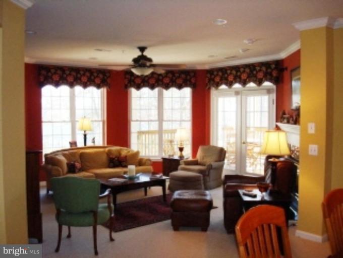 721 Runabout Loop, Unit 721 Solomons, MD 20688 - Photo 5 of 23 a living room with furniture and a window
