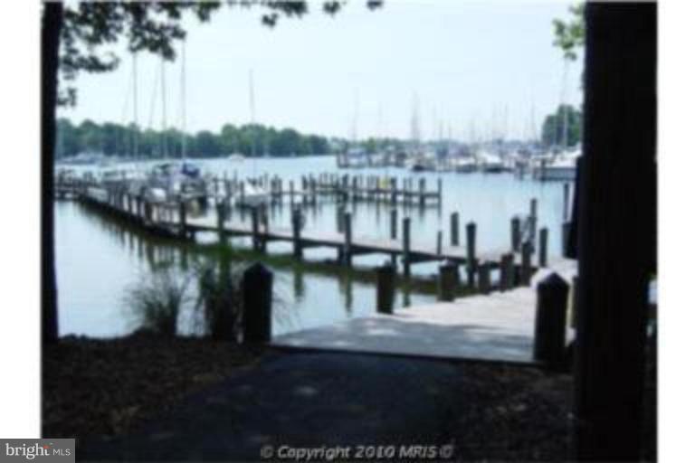721 Runabout Loop, Unit 721 Solomons, MD 20688 - Photo 7 of 23 a view of a lake from a balcony