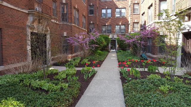 58 Forest Avenue, Unit G Riverside, IL 60546 - Photo 1 of 19 a view of a pathway with a house in the background