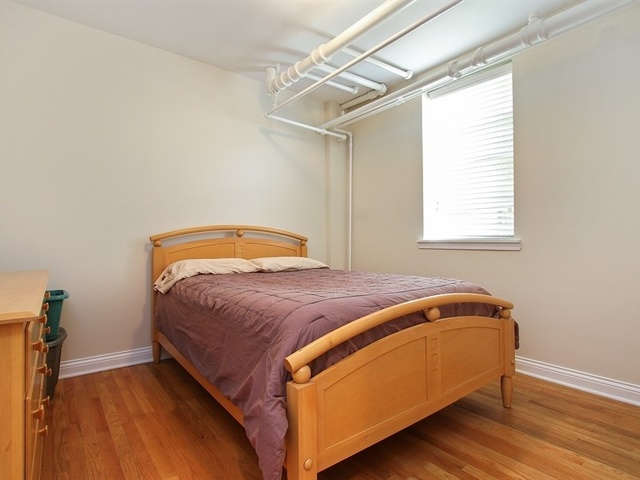 58 Forest Avenue, Unit G Riverside, IL 60546 - Photo 14 of 19 a bedroom with a bed and a window