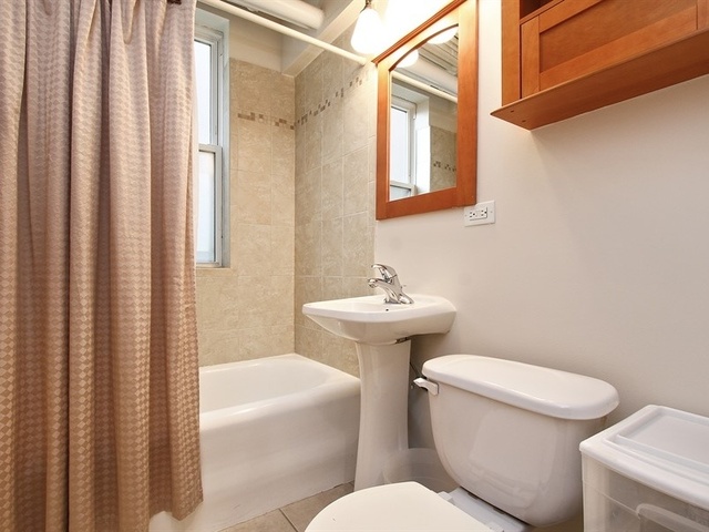 58 Forest Avenue, Unit G Riverside, IL 60546 - Photo 15 of 19 a white toilet sitting next to a bath tub