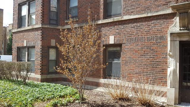 58 Forest Avenue, Unit G Riverside, IL 60546 - Photo 17 of 19 a brick building with a door and a yard